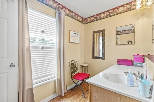 a bathroom with a sink and a mirror