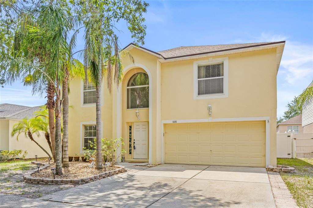 10311 Frog Pond Drive Riverview, FL 33569 - Photo 2 of 39 a front view of a house with street