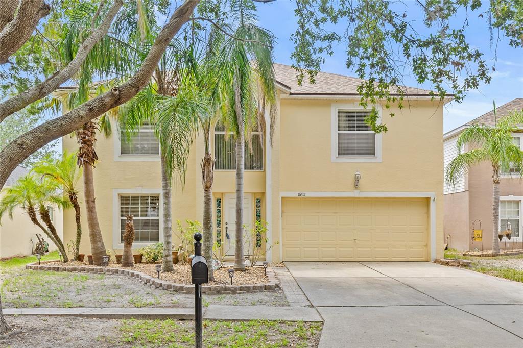 10311 Frog Pond Drive Riverview, FL 33569 - Photo 3 of 39 a front view of a house with street