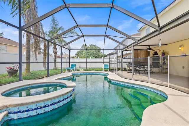 a view of a backyard with swimming pool