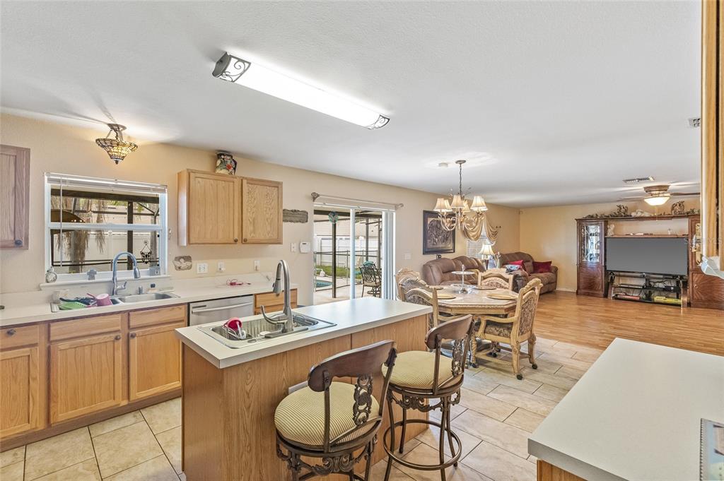 10311 Frog Pond Drive Riverview, FL 33569 - Photo 8 of 39 a large kitchen with a table and chairs in it