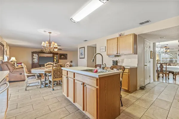 a view of a kitchen with dining area a sink and dishwasher kitchen view