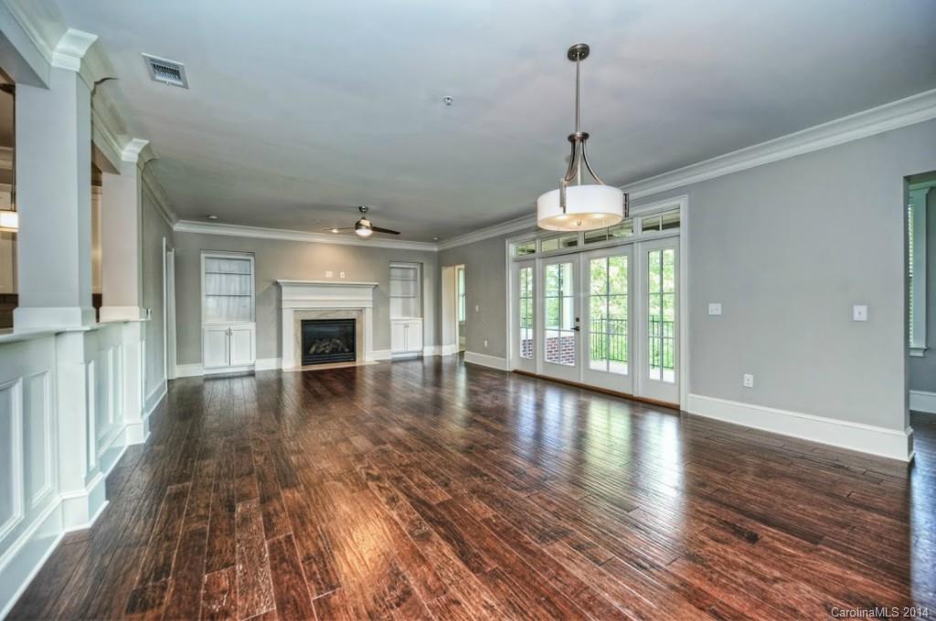 2128 Queens Road West, Unit 2128 Charlotte, NC 28209 - Photo 11 of 21 a view of a room with wooden floor fireplace and windows