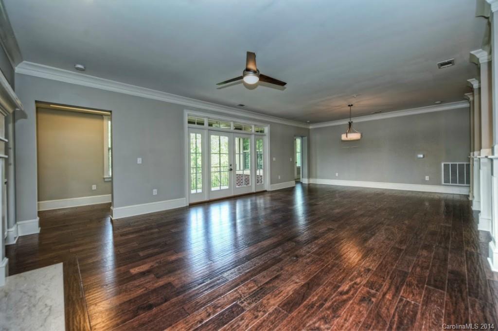 2128 Queens Road West, Unit 2128 Charlotte, NC 28209 - Photo 13 of 21 wooden floor in an empty room with a window