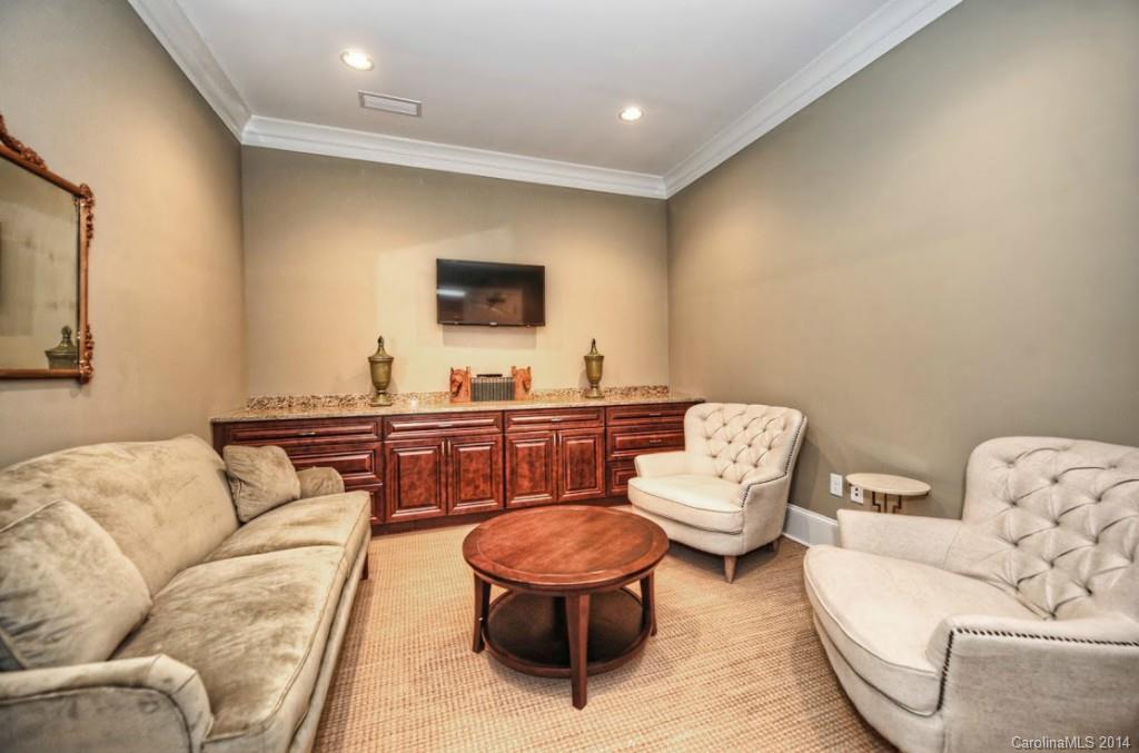 2128 Queens Road West, Unit 2128 Charlotte, NC 28209 - Photo 18 of 21 a living room with furniture and a flat screen tv