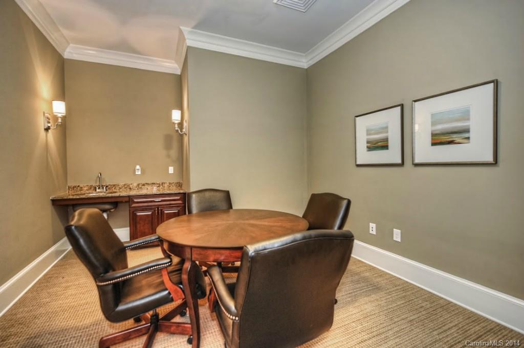 2128 Queens Road West, Unit 2128 Charlotte, NC 28209 - Photo 19 of 21 a view of a dining room with furniture and wooden floor