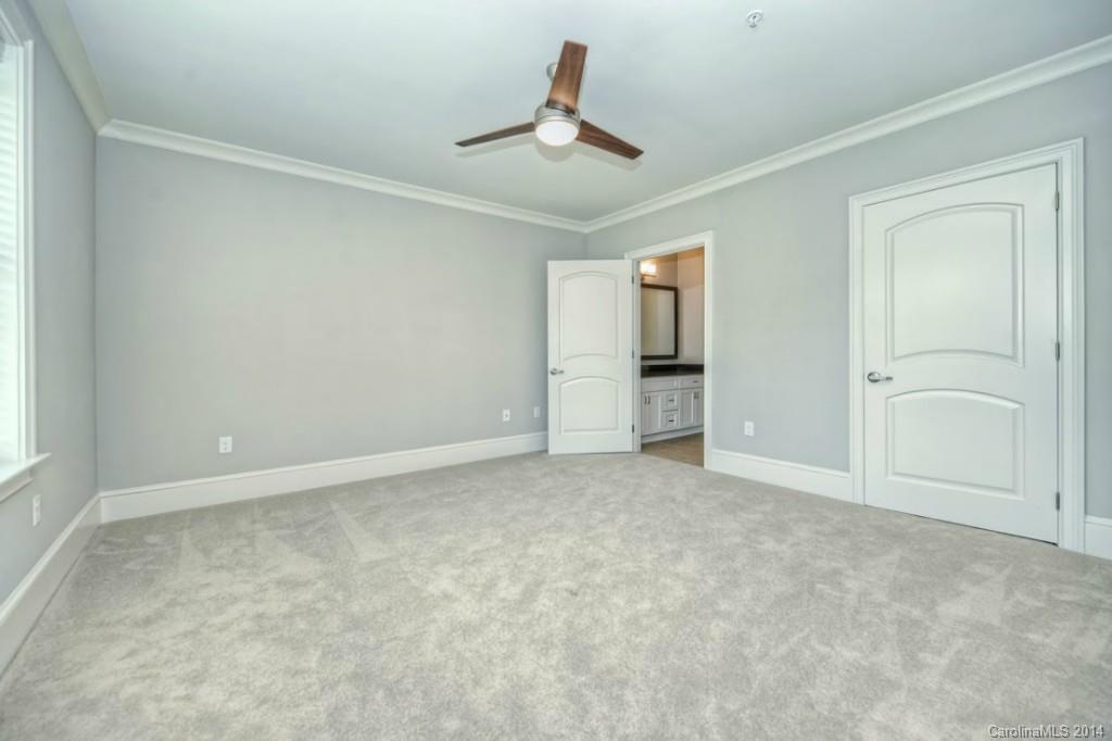 2128 Queens Road West, Unit 2128 Charlotte, NC 28209 - Photo 7 of 21 an empty room with closet and windows