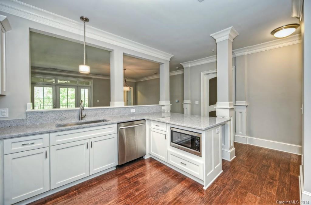 2128 Queens Road West, Unit 2128 Charlotte, NC 28209 - Photo 8 of 21 a kitchen with a stove and sink