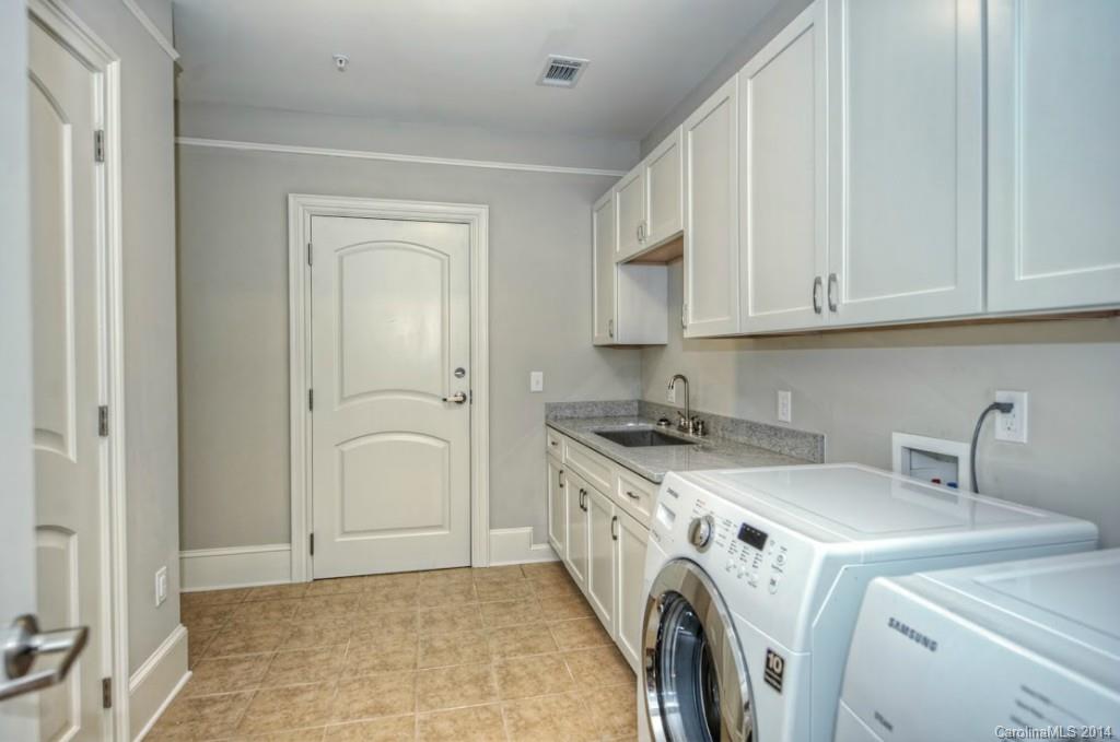 2128 Queens Road West, Unit 2128 Charlotte, NC 28209 - Photo 10 of 21 a utility room with dryer and washer