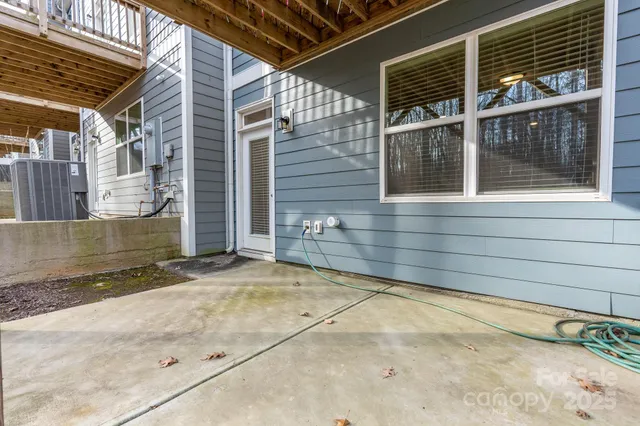 a view of a house with a wooden fence