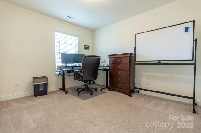 a bedroom with a bed and a ceiling fan