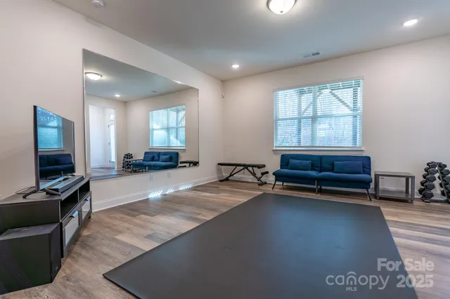 a view of a livingroom with furniture and a flat screen tv