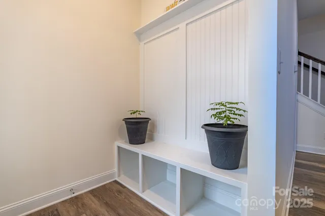 a view of dining room with wooden floor and table