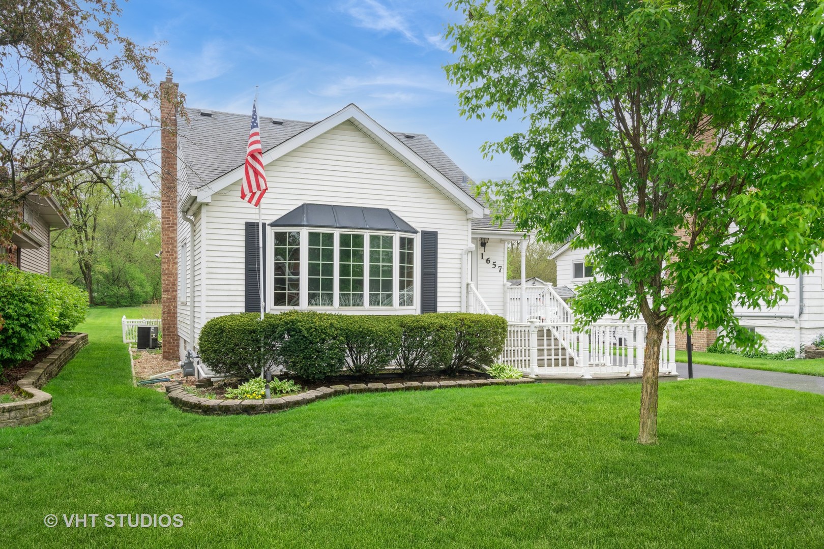 1657 Ridge Road Homewood, IL 60430 - Photo 2 of 19 a front view of a house with a yard