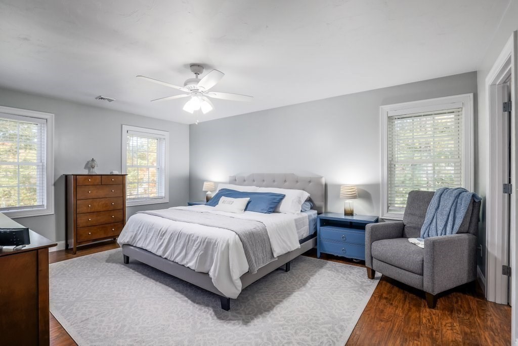 65 Haggerty Road Charlton, MA 01507 - Photo 21 of 34 a bedroom with a bed couch and windows