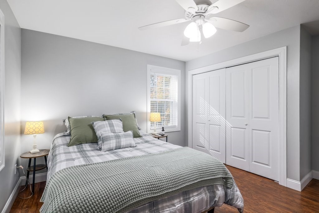 65 Haggerty Road Charlton, MA 01507 - Photo 27 of 34 a bedroom with a bed and a chandelier