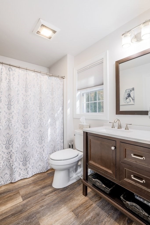 65 Haggerty Road Charlton, MA 01507 - Photo 32 of 34 a bathroom with a sink toilet a mirror and vanity
