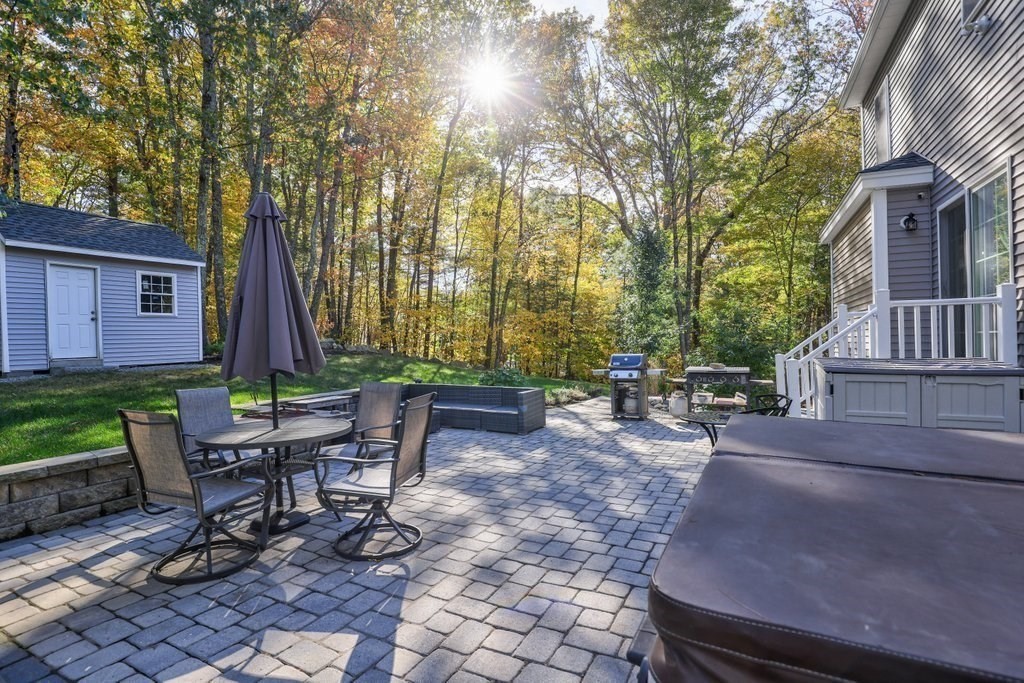 65 Haggerty Road Charlton, MA 01507 - Photo 7 of 34 a view of a patio with table and chairs and potted plants