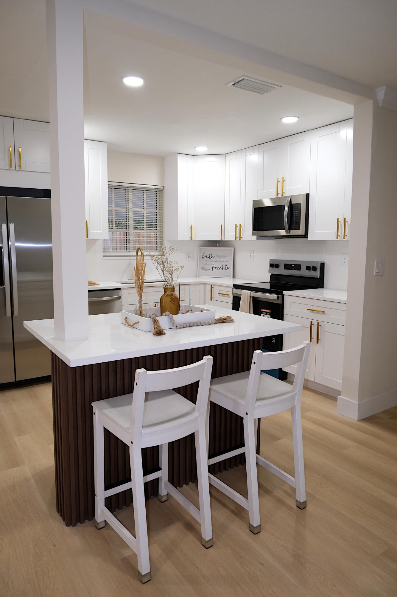 1084 Southwest 4th Avenue Pompano Beach, FL 33060 - Photo 5 of 35 a kitchen with a dining table chairs and refrigerator