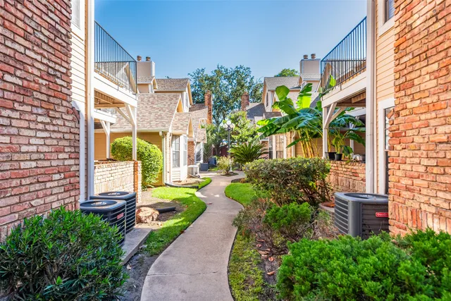 a view of a garden with a bench