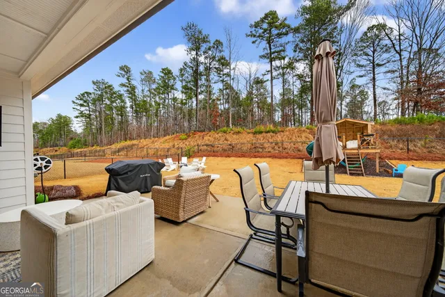a living room with furniture and a table