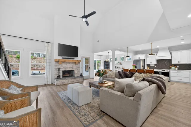 a living room with furniture fireplace and a flat screen tv