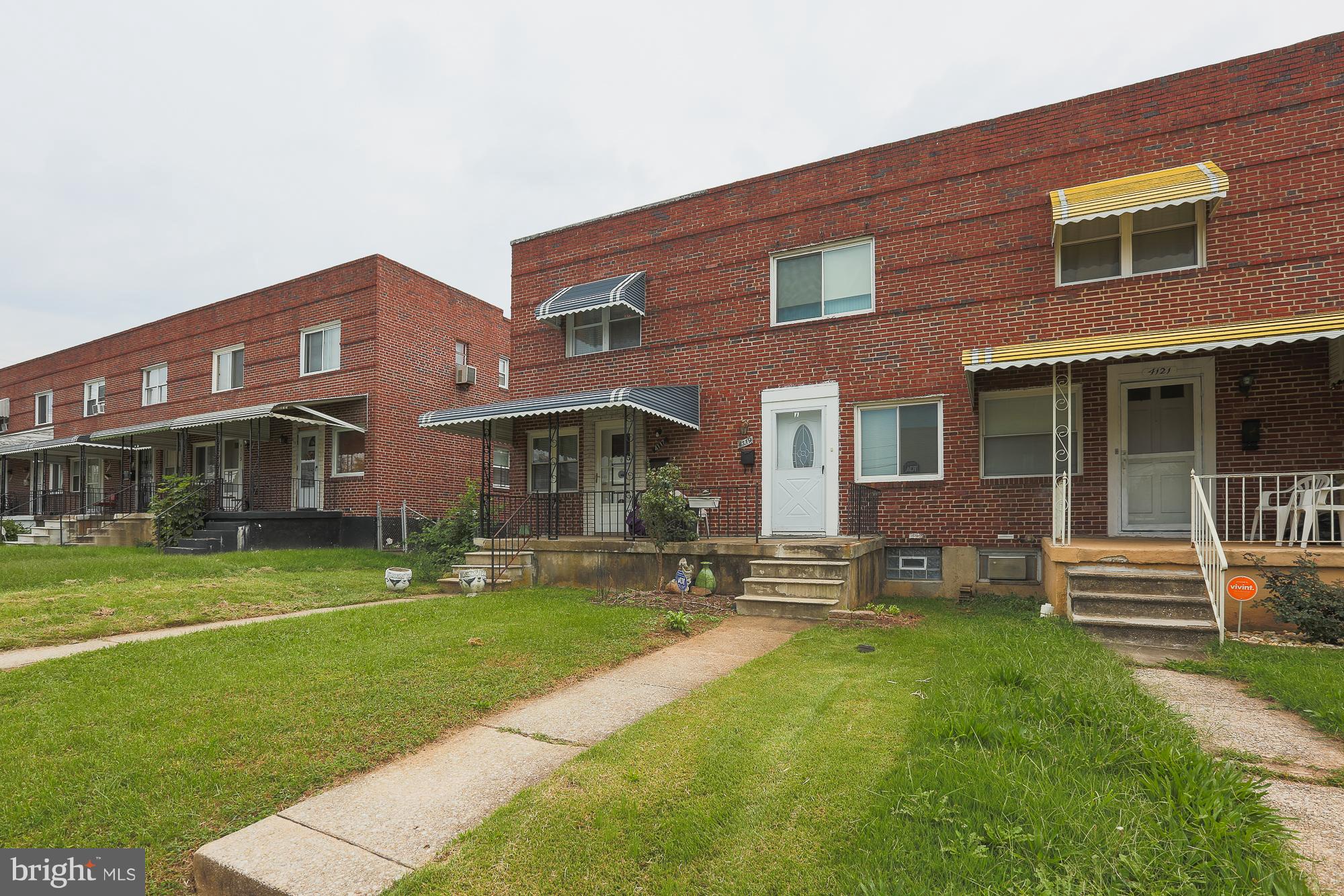 4119 Crest Heights Road Baltimore, MD 21215 - Photo 2 of 32 a front view of a building with a garden
