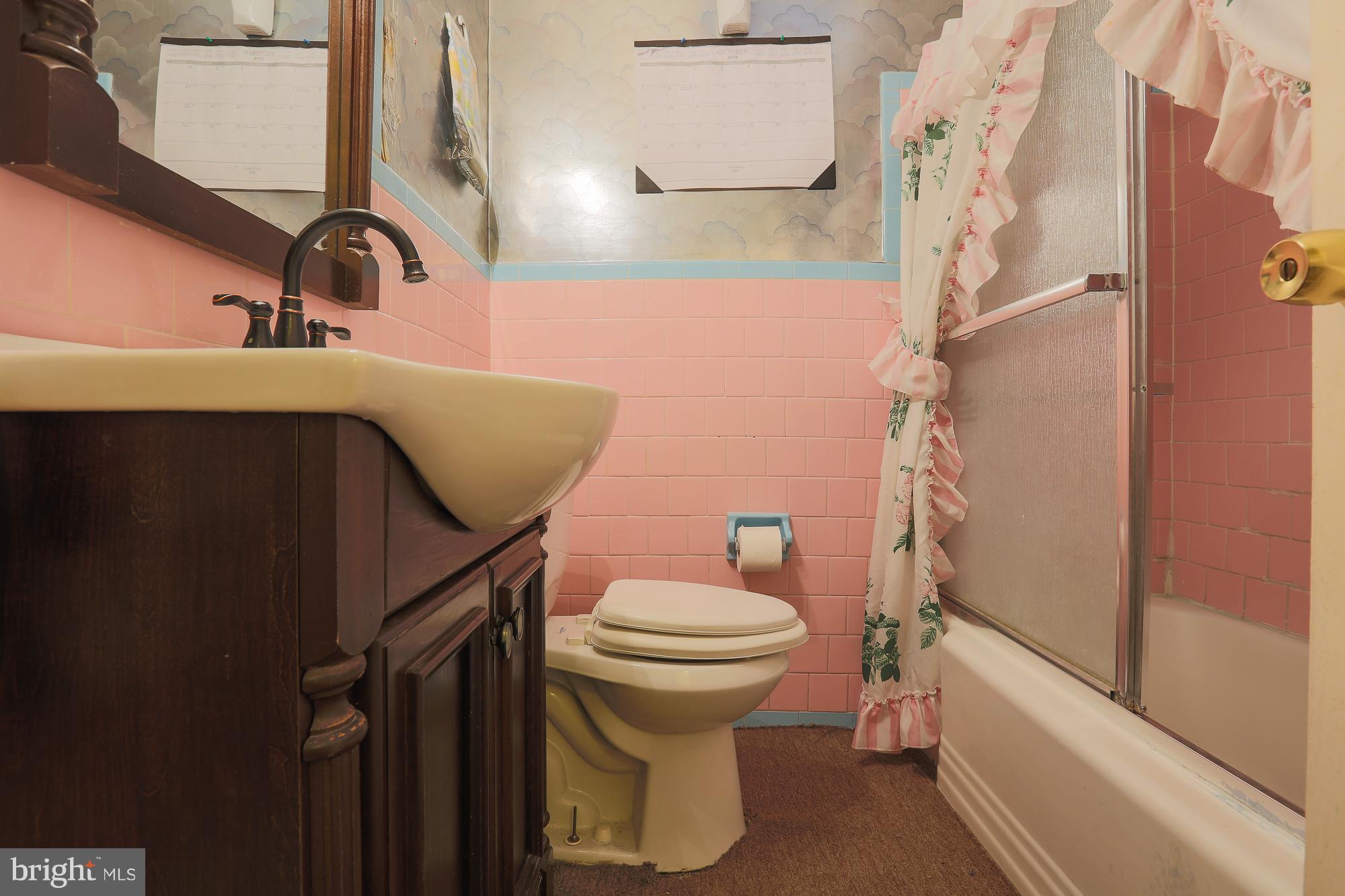 4119 Crest Heights Road Baltimore, MD 21215 - Photo 20 of 32 a bathroom with a sink and toilet
