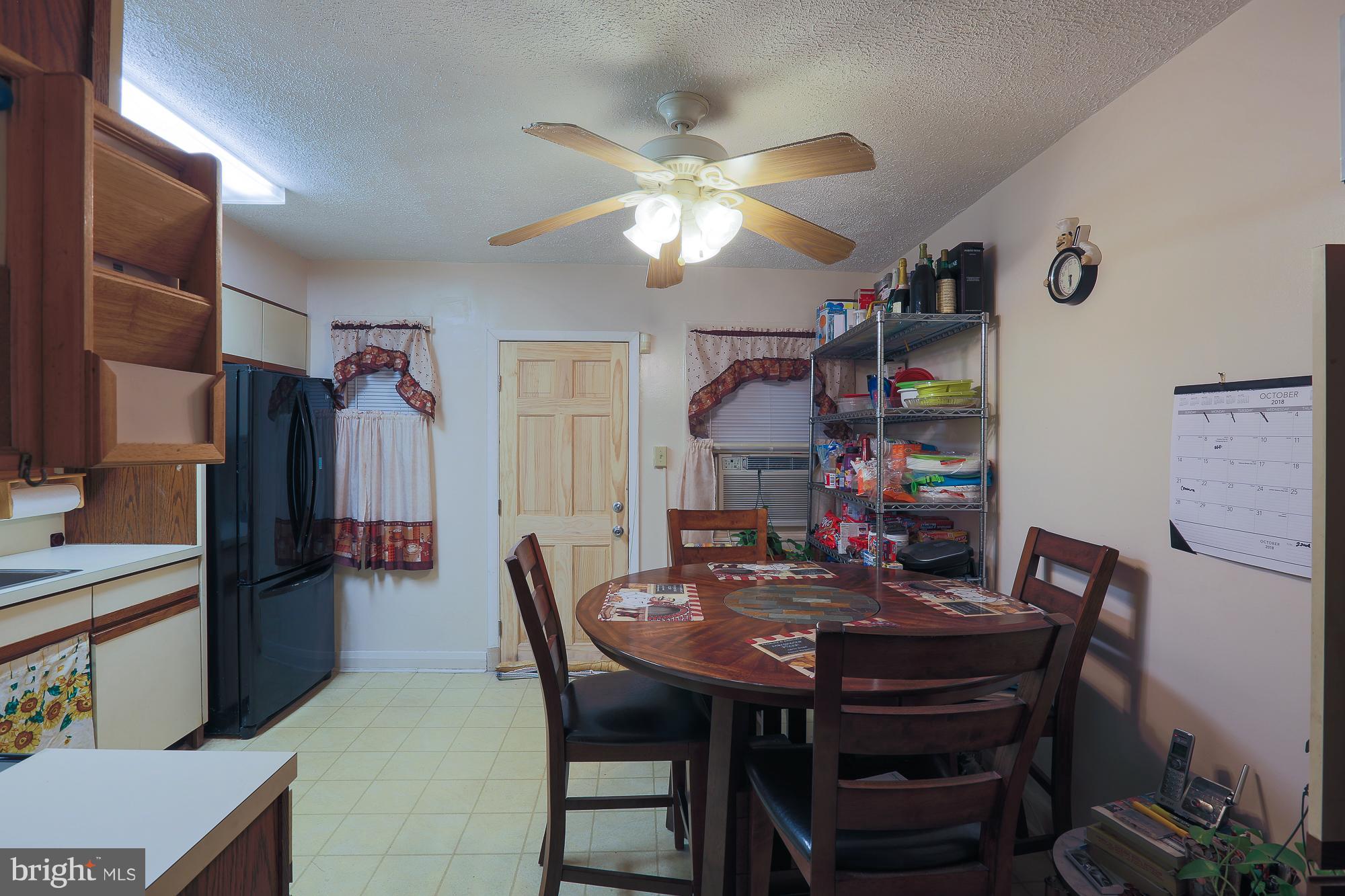 4119 Crest Heights Road Baltimore, MD 21215 - Photo 29 of 32 a view of a dining room with furniture