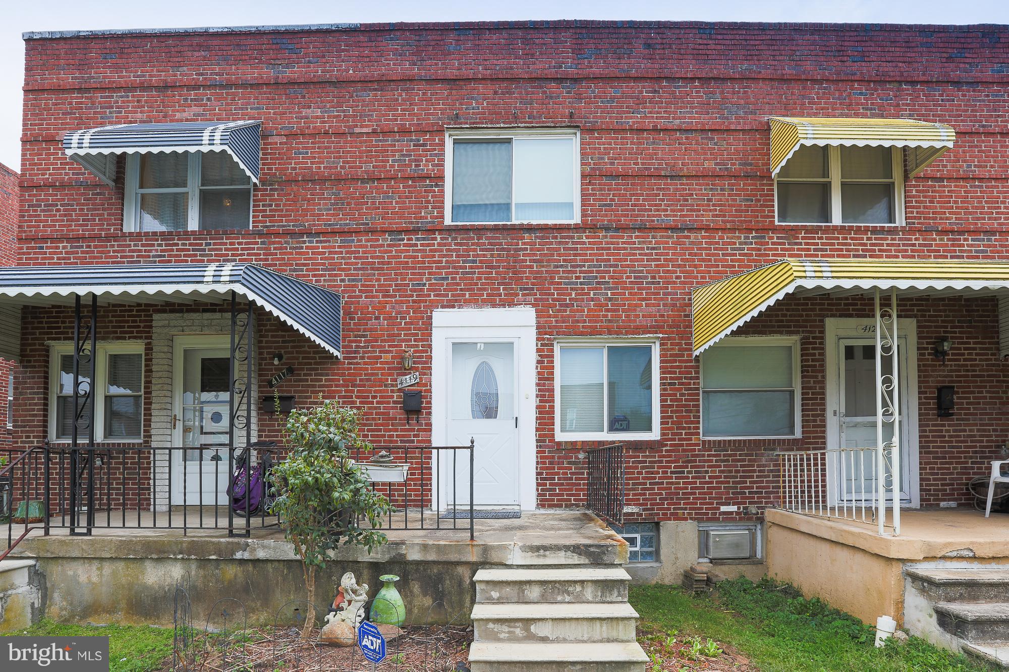 4119 Crest Heights Road Baltimore, MD 21215 - Photo 5 of 32 a front view of a house with garden