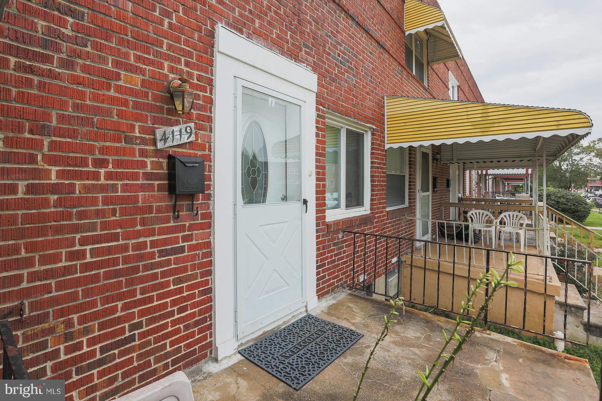 4119 Crest Heights Road Baltimore, MD 21215 - Photo 8 of 32 a view of a brick house with a large window
