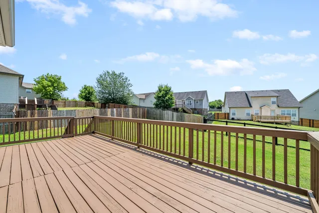 a view of balcony with wooden floor