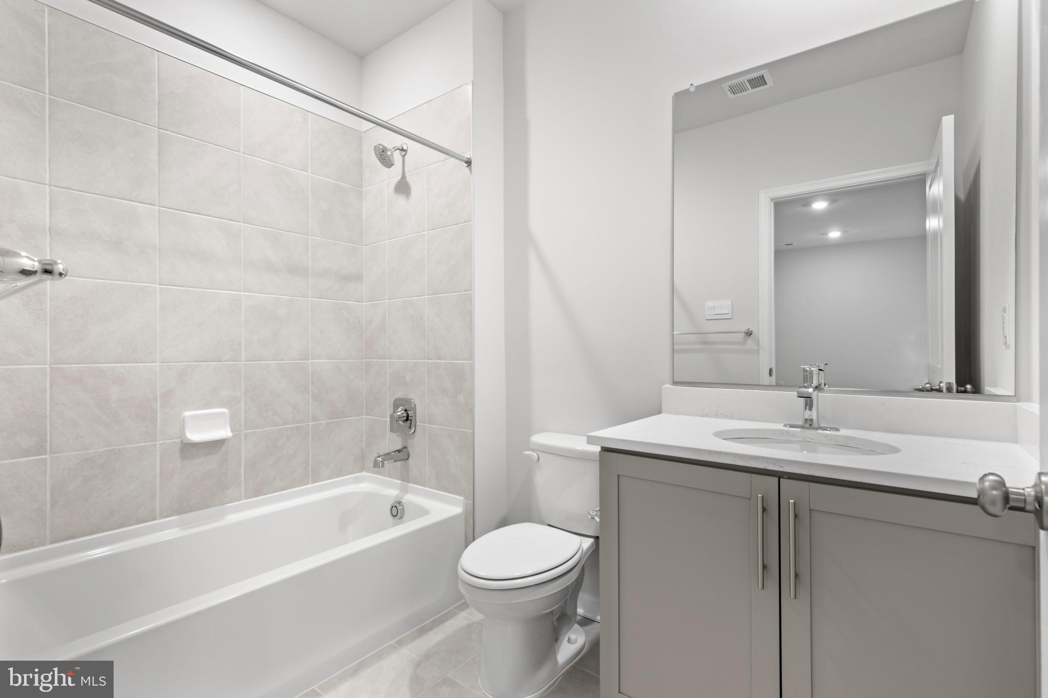 562 Atkinson Street Charles Town, WV 25414 - Photo 19 of 33 a bathroom with a sink a toilet and a bathtub
