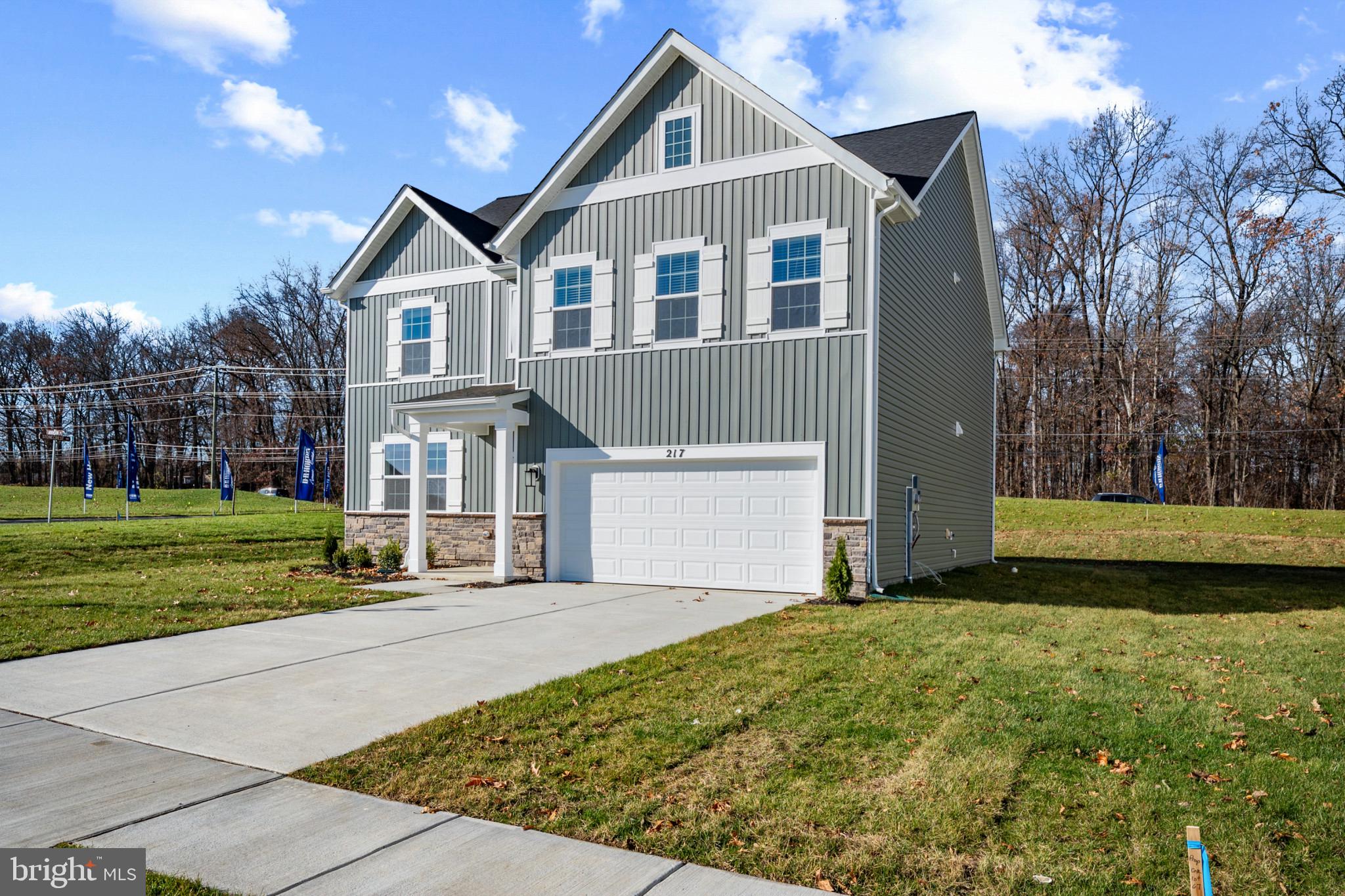562 Atkinson Street Charles Town, WV 25414 - Photo 2 of 33 a front view of a house with a yard