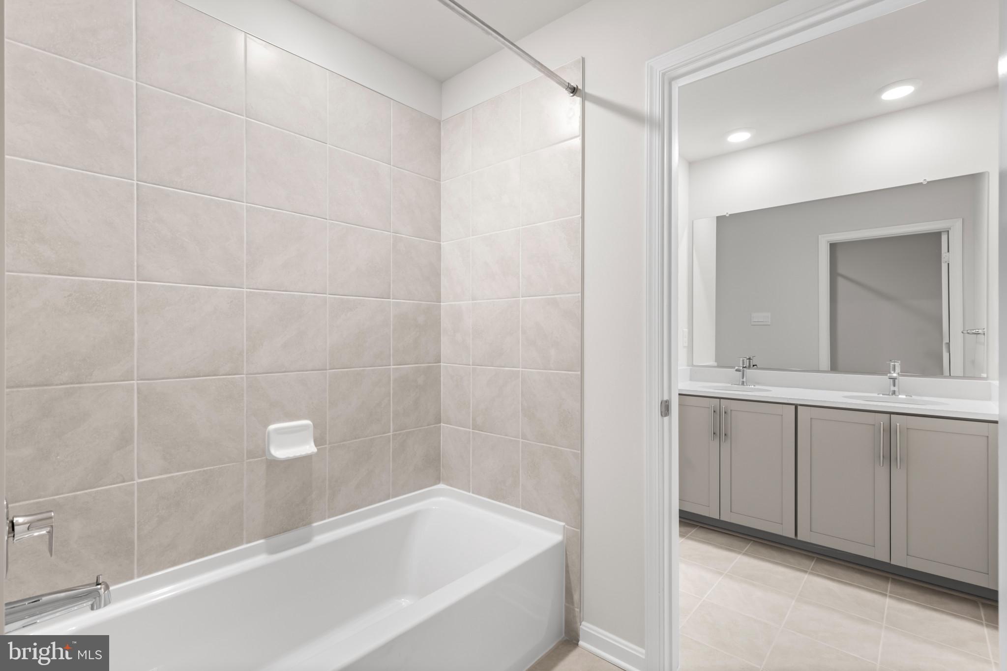 562 Atkinson Street Charles Town, WV 25414 - Photo 23 of 33 a bathroom with a bathtub and a sink