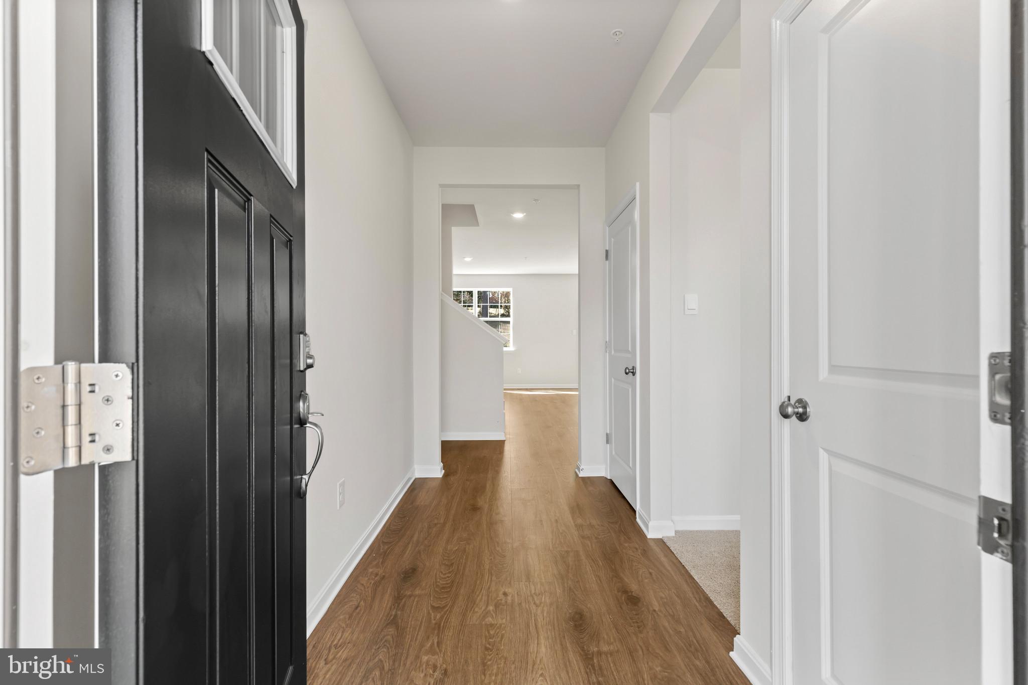 562 Atkinson Street Charles Town, WV 25414 - Photo 4 of 33 a view of a hallway with wooden floor