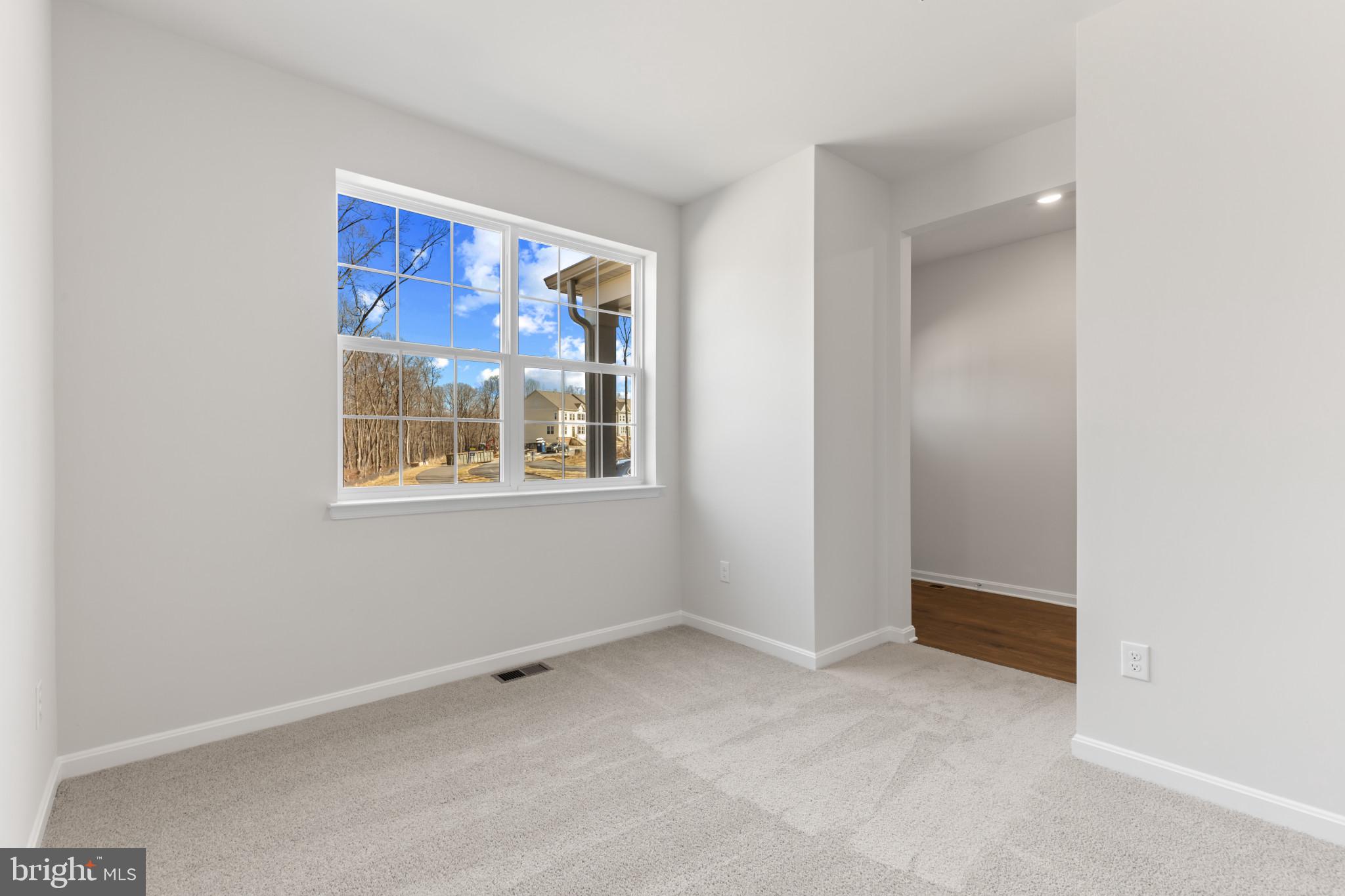 562 Atkinson Street Charles Town, WV 25414 - Photo 5 of 33 an empty room with windows