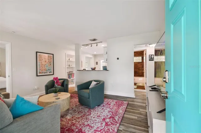 a living room with furniture and a rug