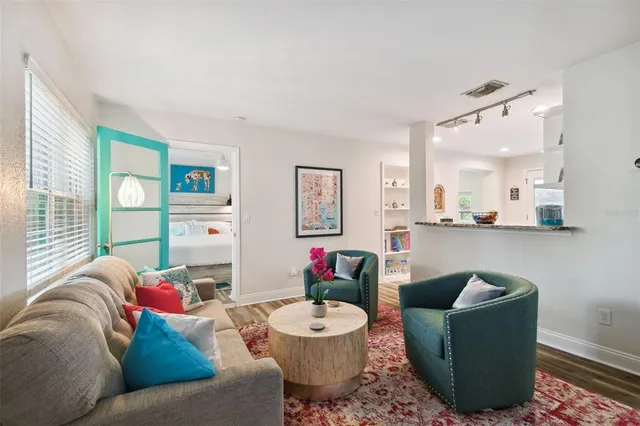 a living room with furniture and a large window