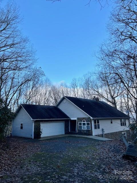 a house with lots of trees in the background