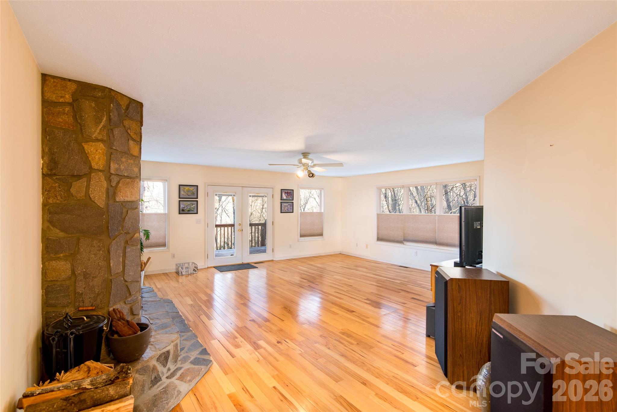 194 Ridgeview Drive Whittier, NC 28789 - Photo 11 of 43 a bedroom with a bed and wooden floor
