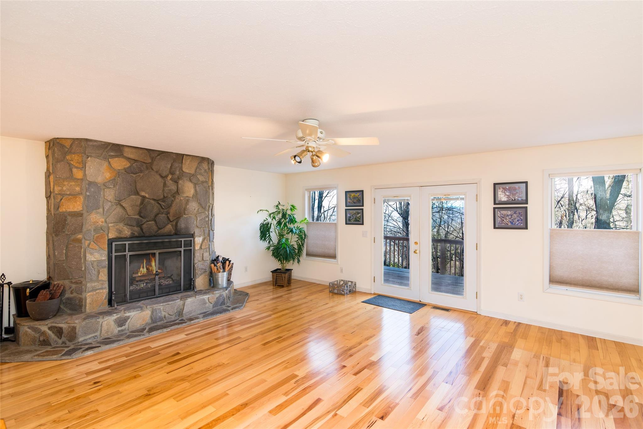 194 Ridgeview Drive Whittier, NC 28789 - Photo 12 of 43 a view of an empty room with a fireplace and a window