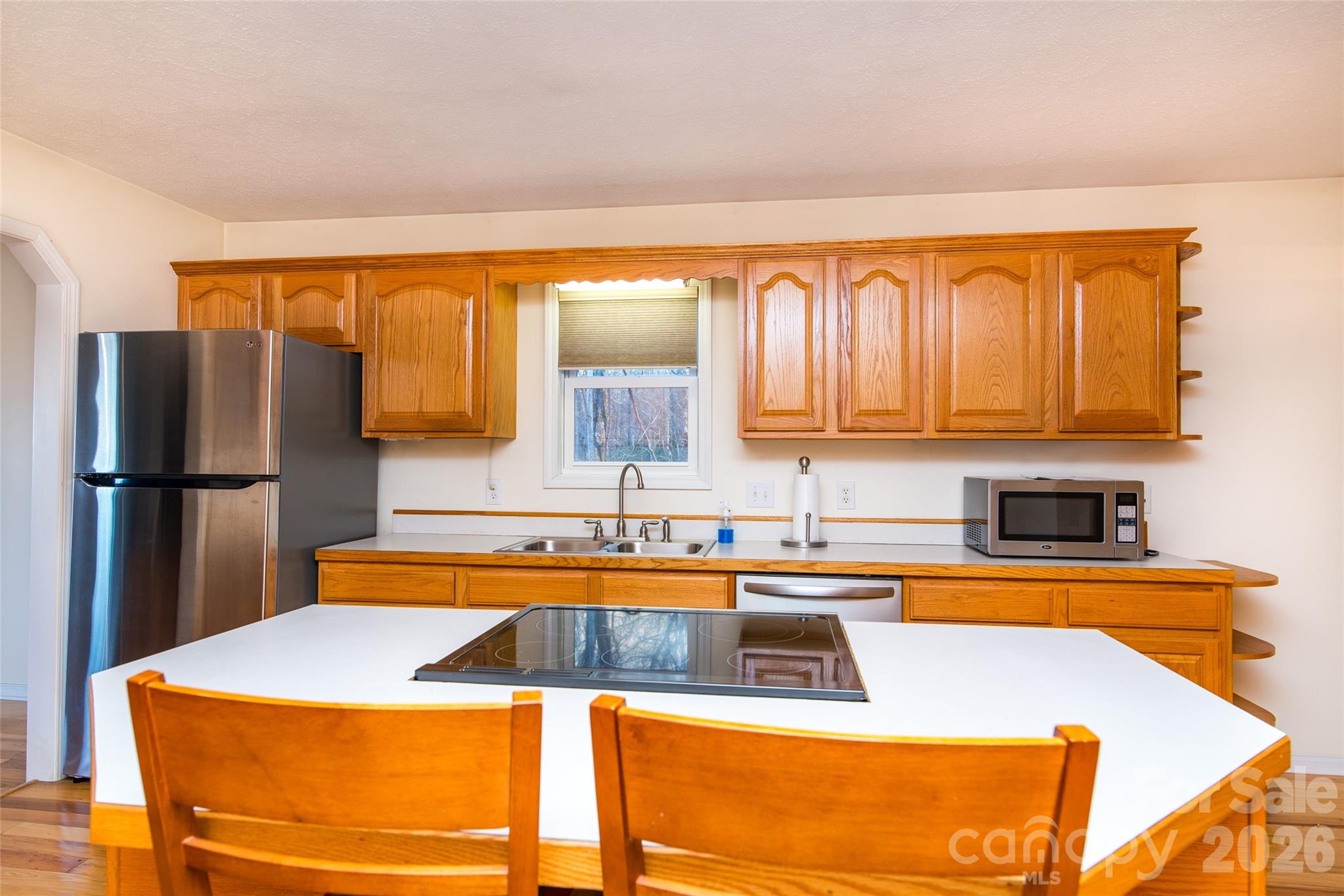194 Ridgeview Drive Whittier, NC 28789 - Photo 14 of 43 a kitchen with stainless steel appliances granite countertop a sink and a refrigerator