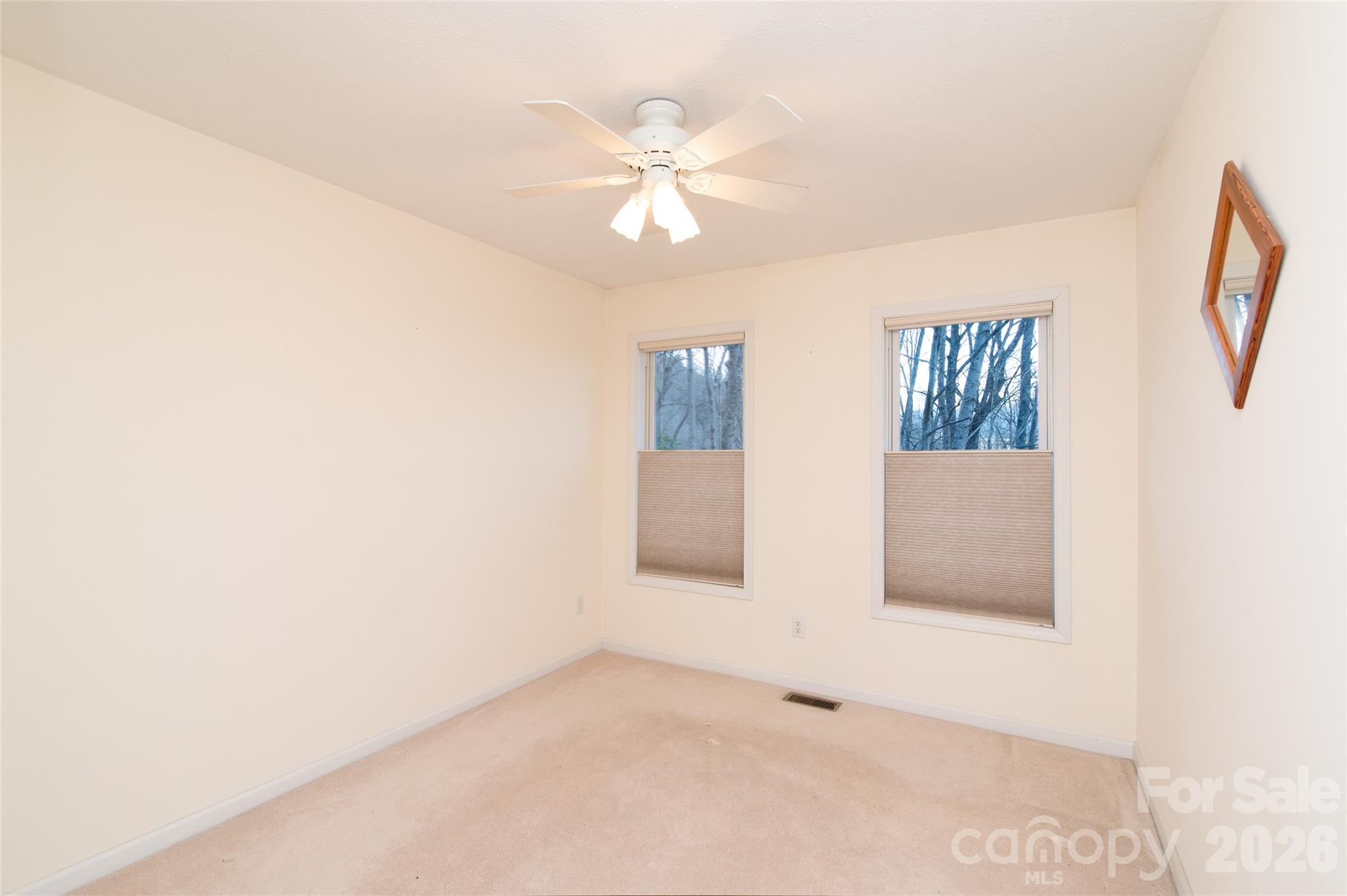 194 Ridgeview Drive Whittier, NC 28789 - Photo 19 of 43 an empty room with windows and fan