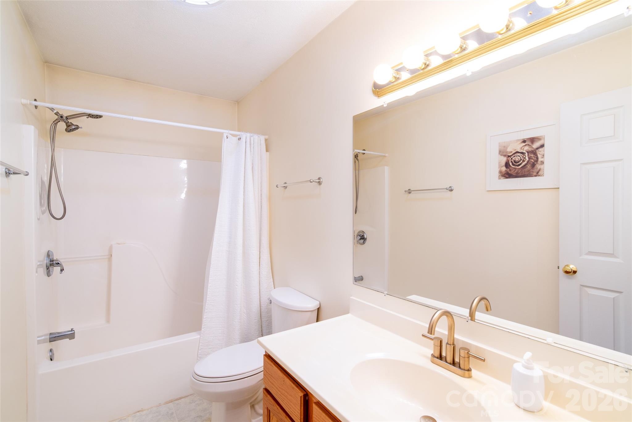 194 Ridgeview Drive Whittier, NC 28789 - Photo 25 of 43 a bathroom with a sink toilet and shower