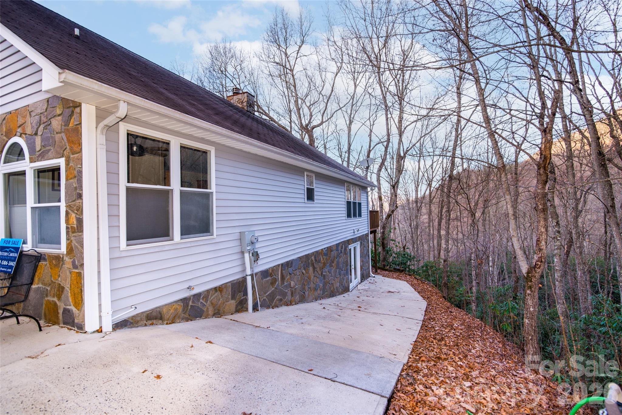 194 Ridgeview Drive Whittier, NC 28789 - Photo 7 of 43 a view of backyard with large tree and wooden fence
