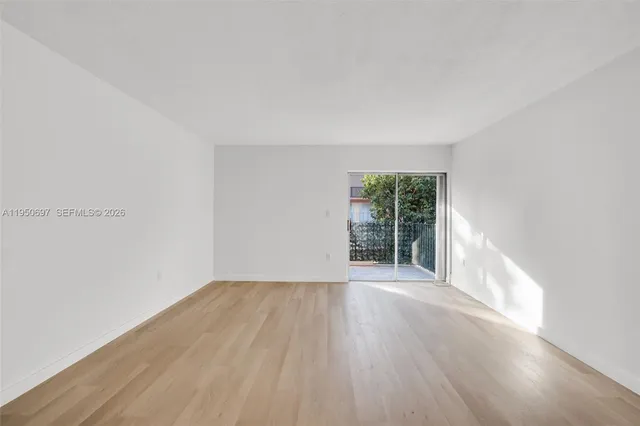 a view of a kitchen with a sink and cabinets