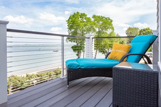 a view of a balcony with chairs