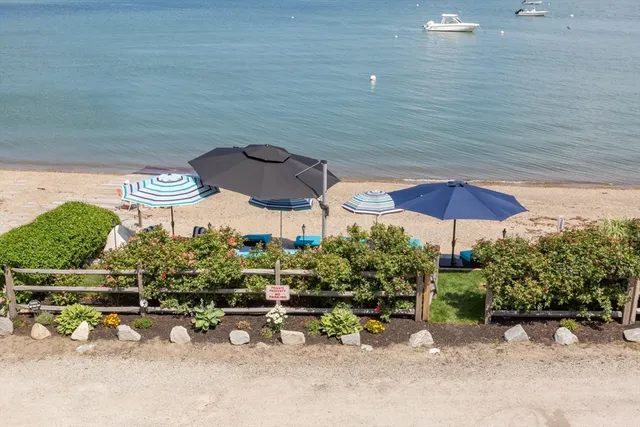 an outdoor space with furniture and umbrella