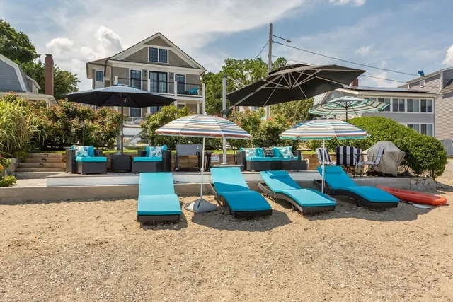 a view of a table and chairs under an umbrella